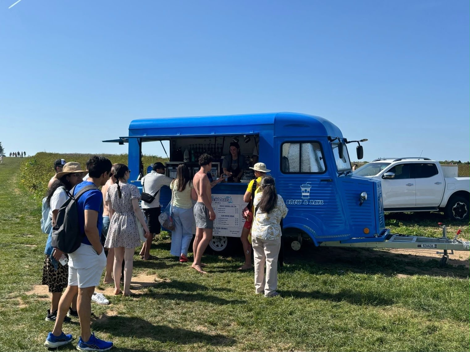Customers queueing at Brew & Bays coffee trailer at Botany Bay, Broadstairs